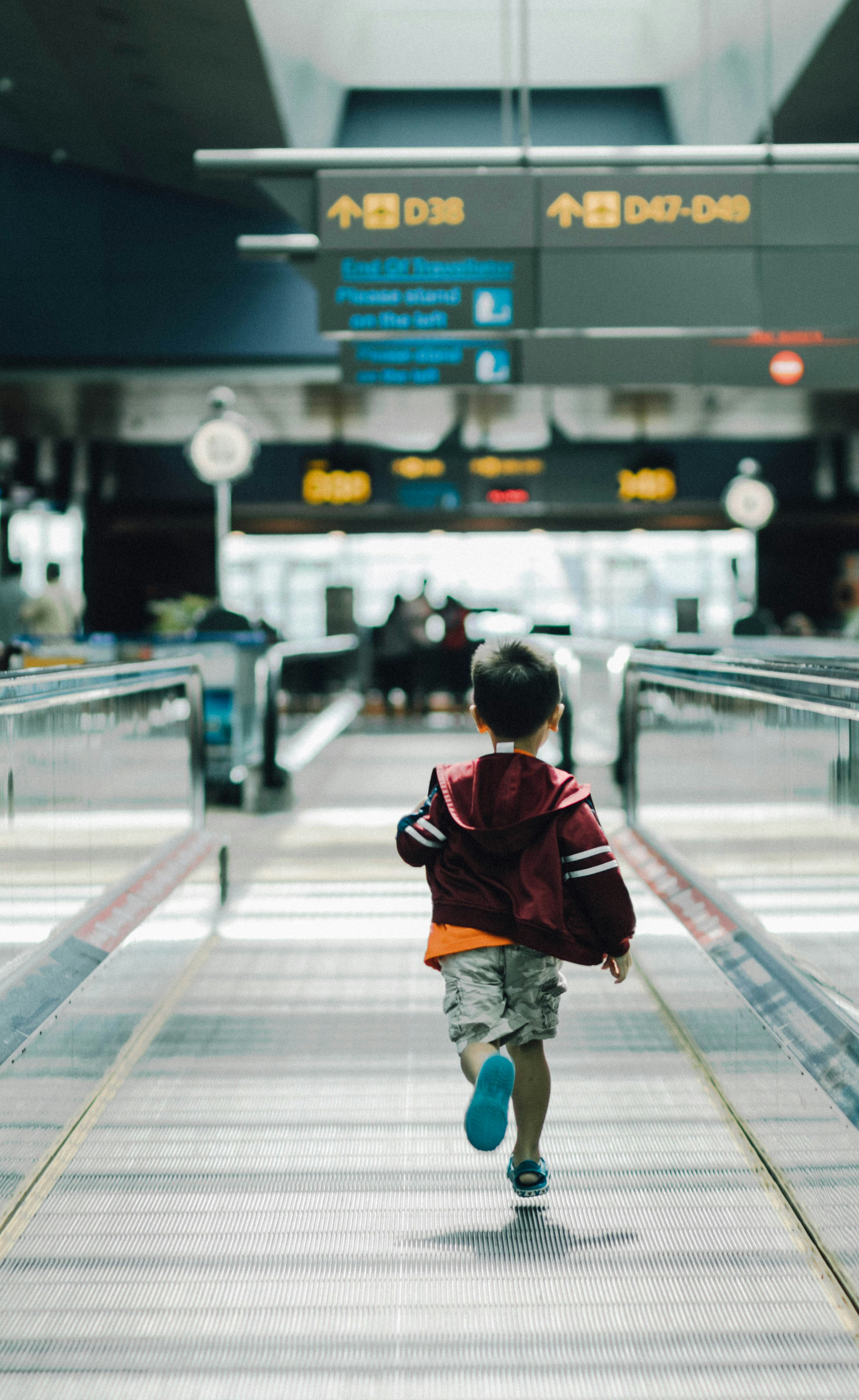 A boy running in the airport