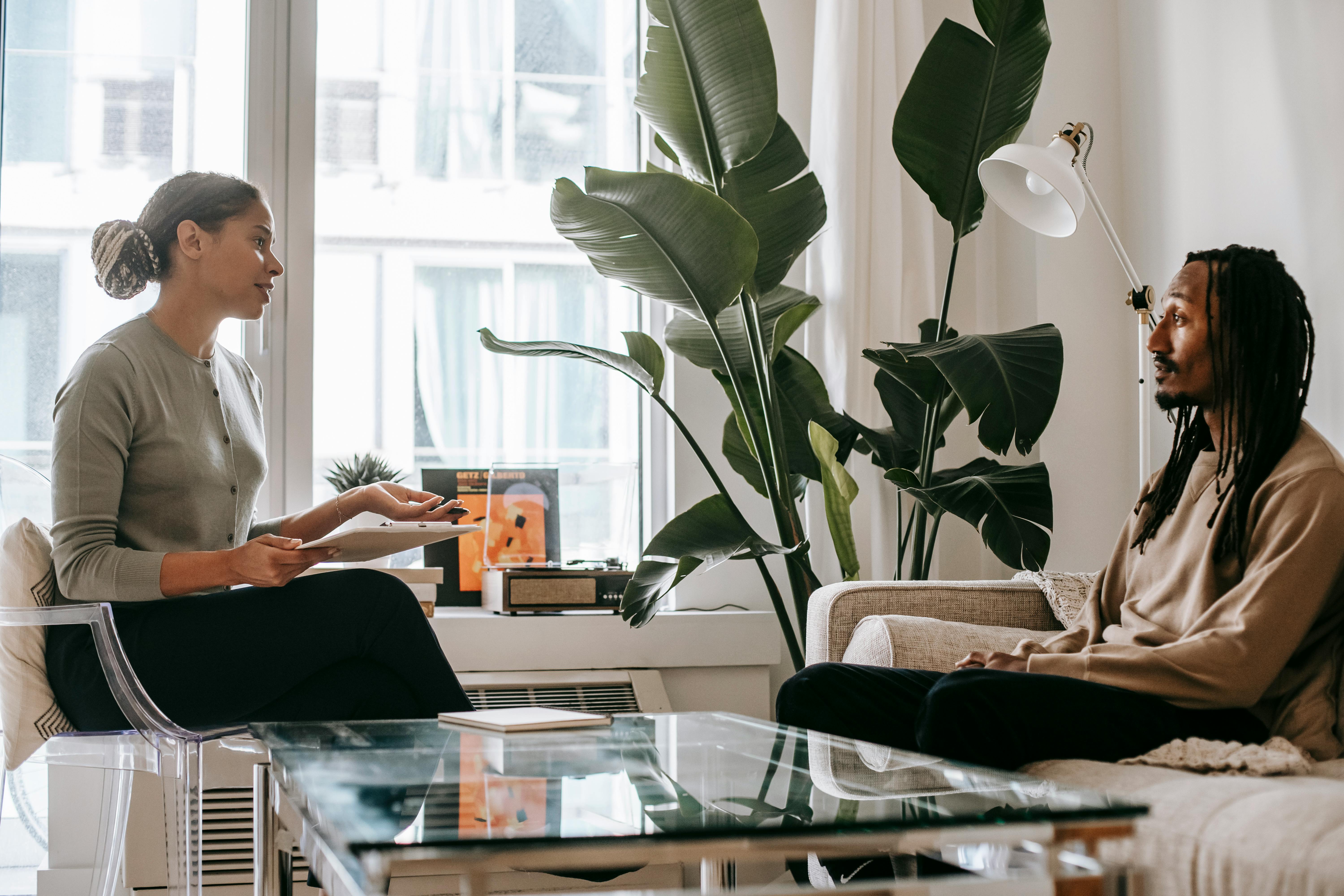 A psychologist talking to a patient