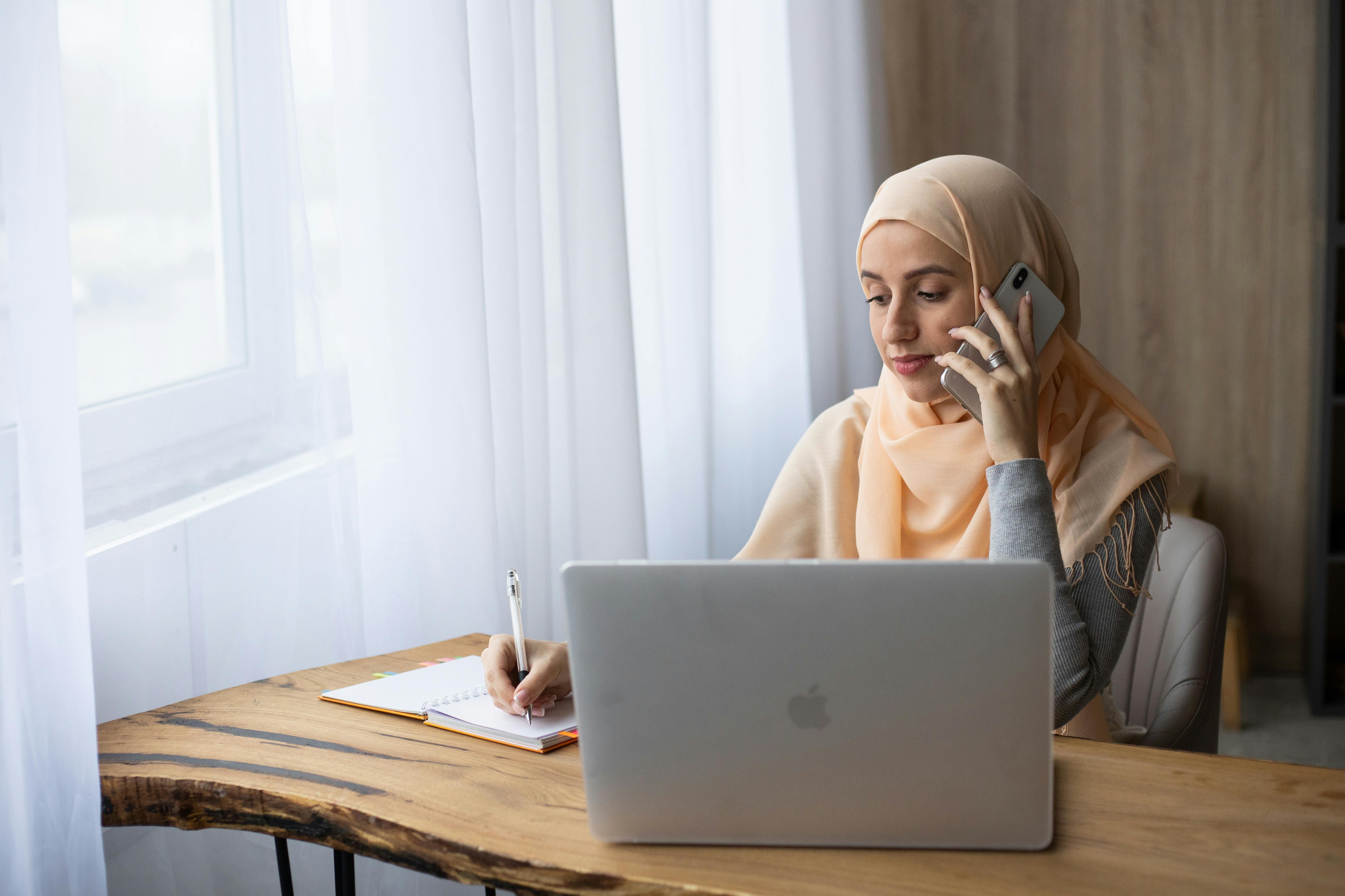 A woman scheduling an appointment over the phone