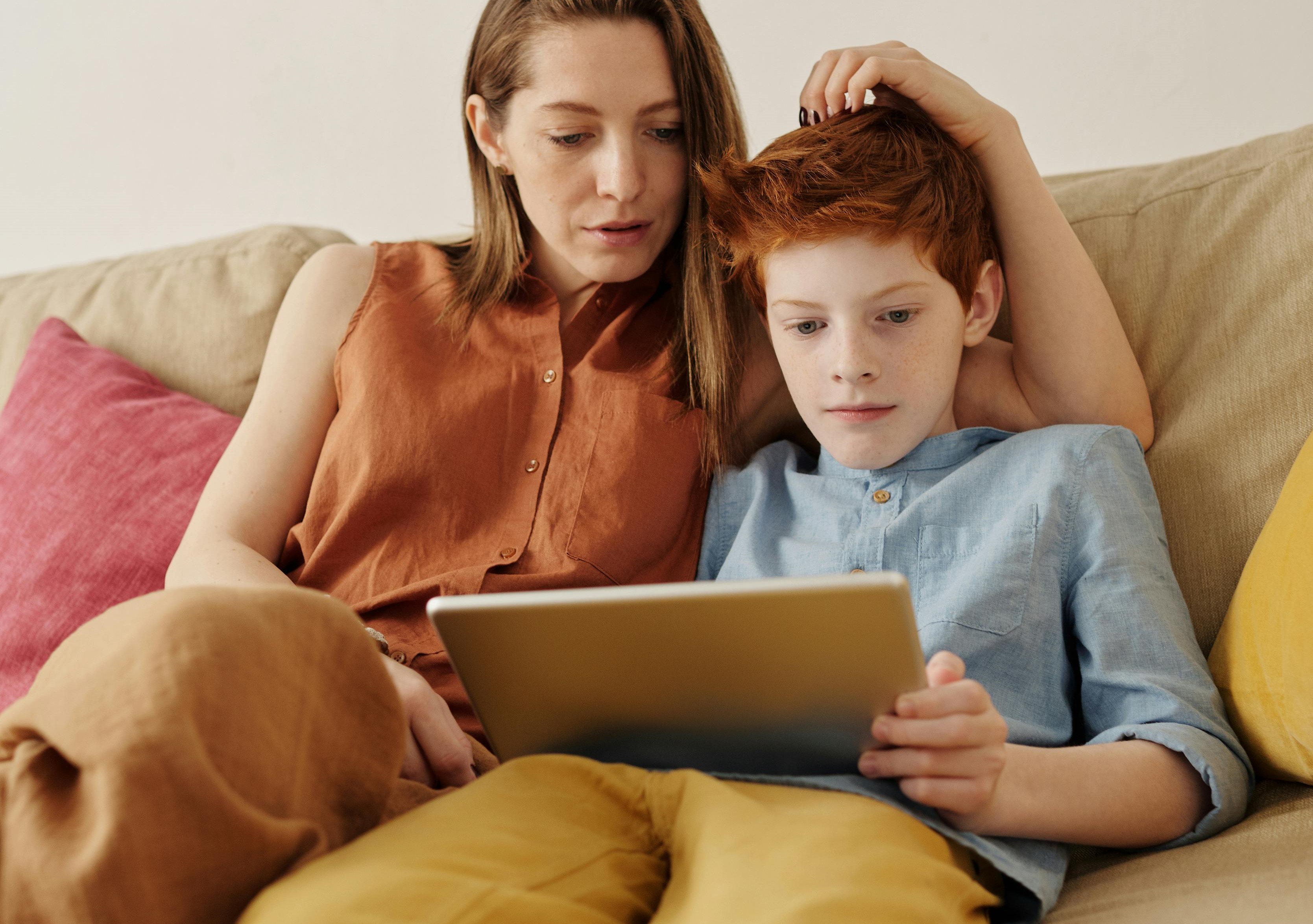 Photo of a mother and her son using a Tablet