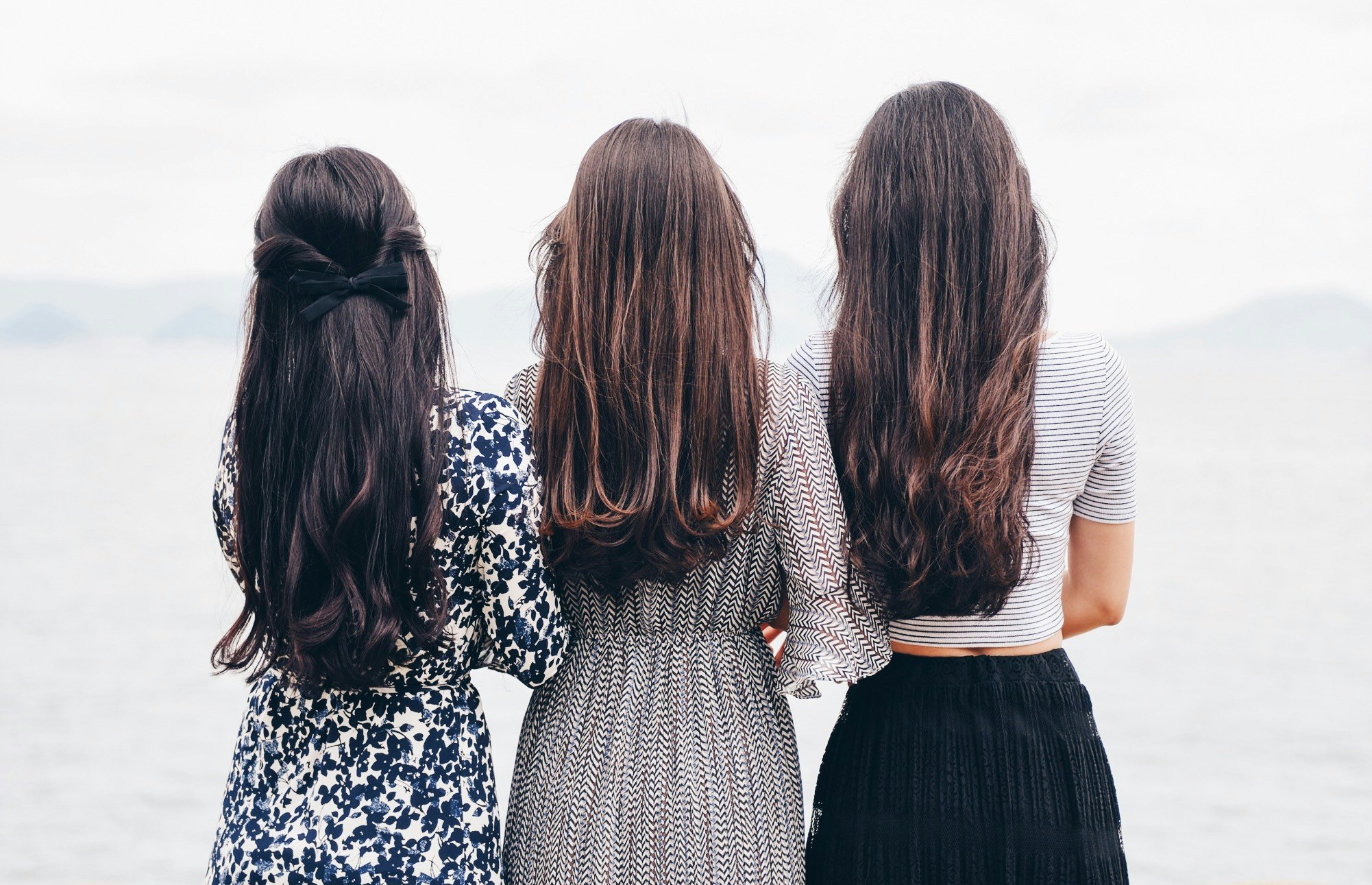 three women overlooking water