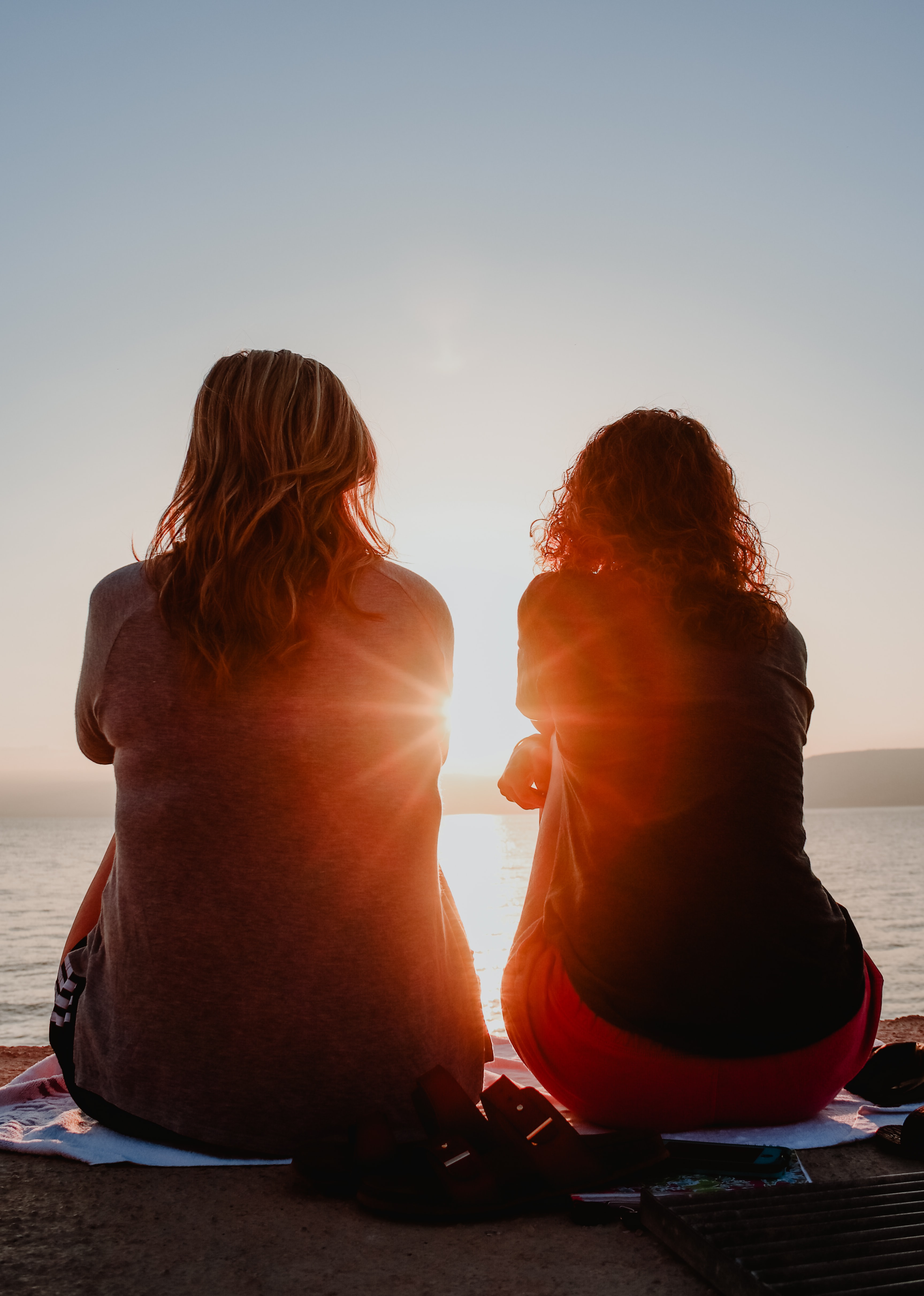 Two people watching the sunset together