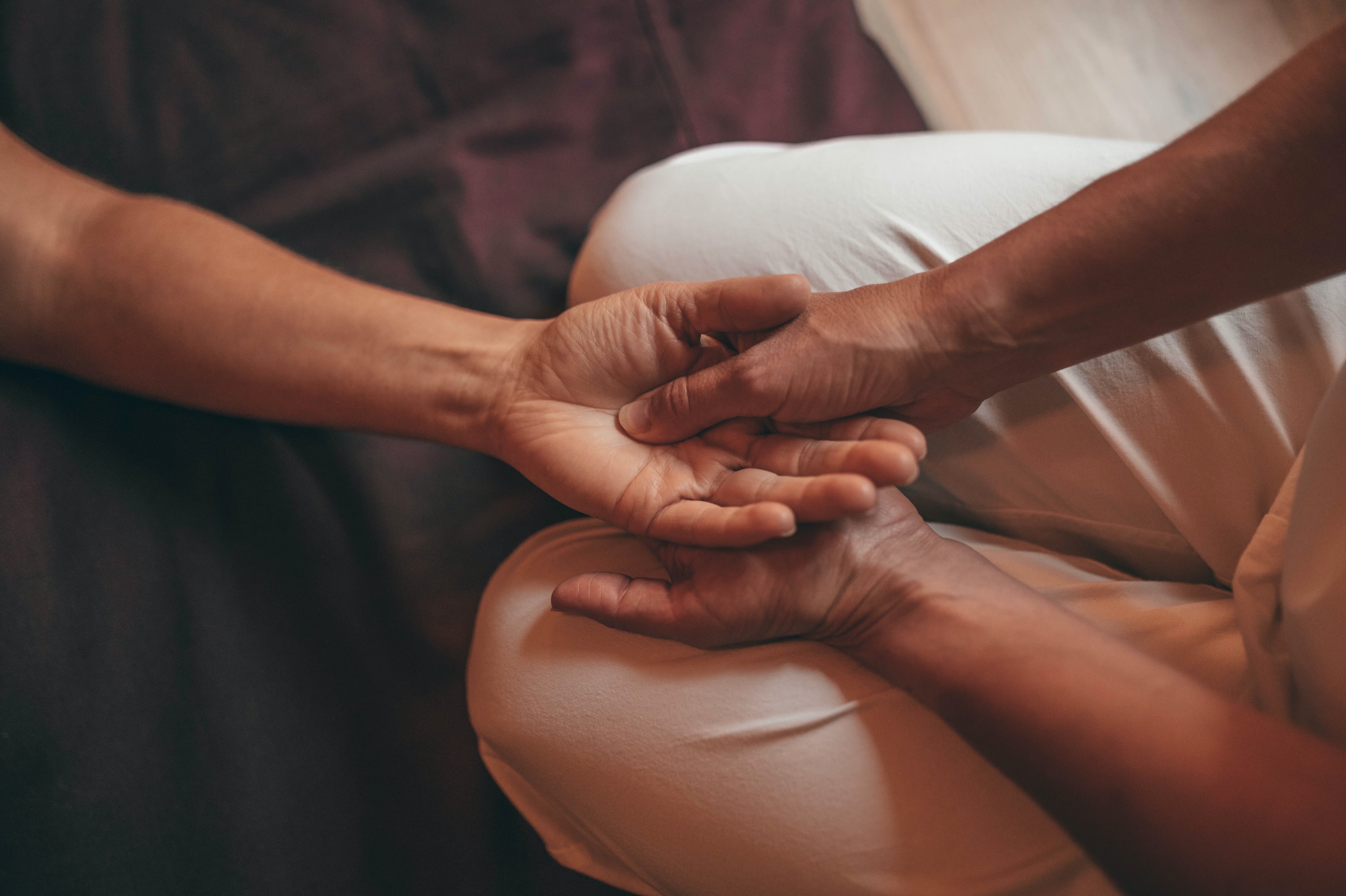 A person holding another person's hand