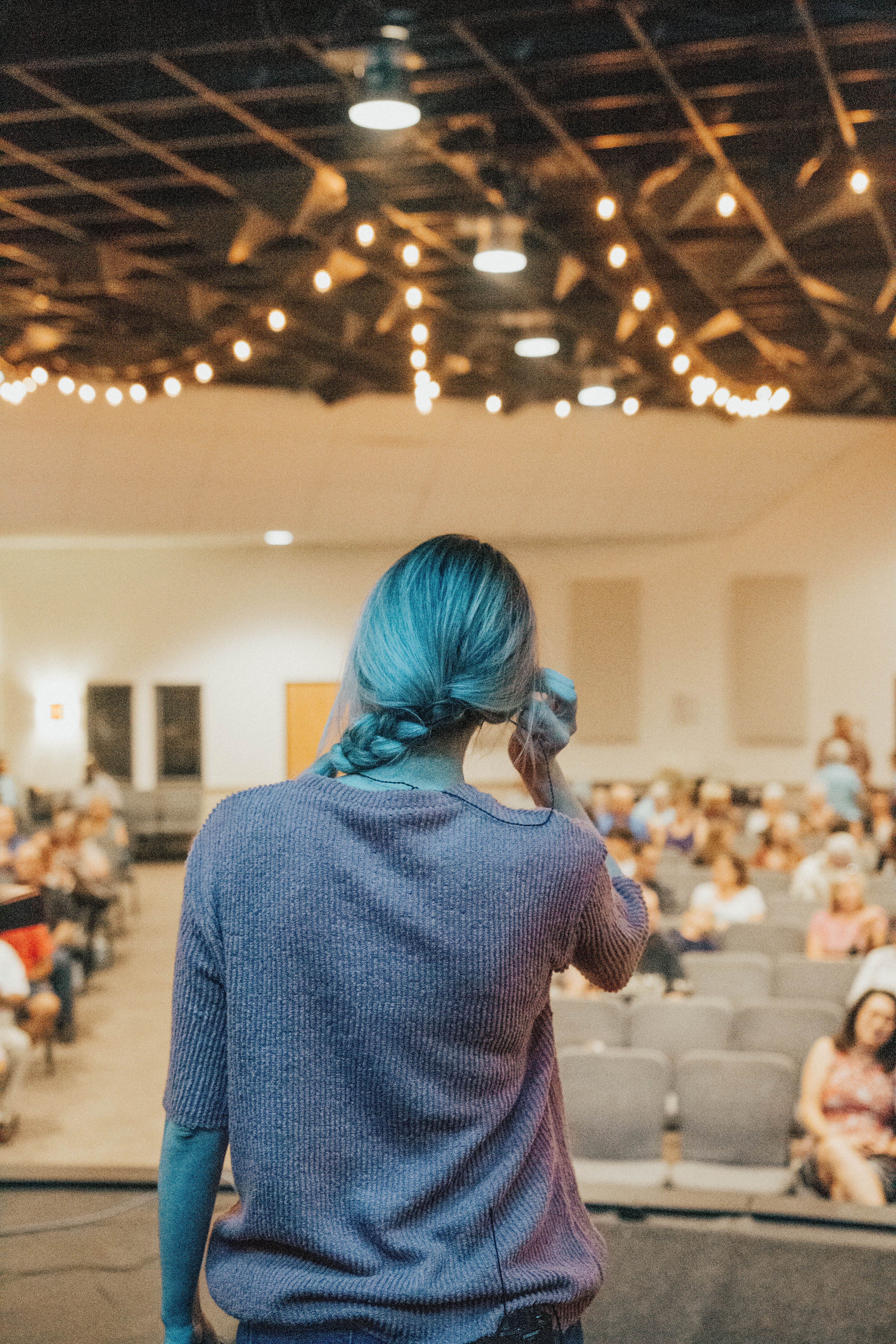 Woman standing in front of crowd
