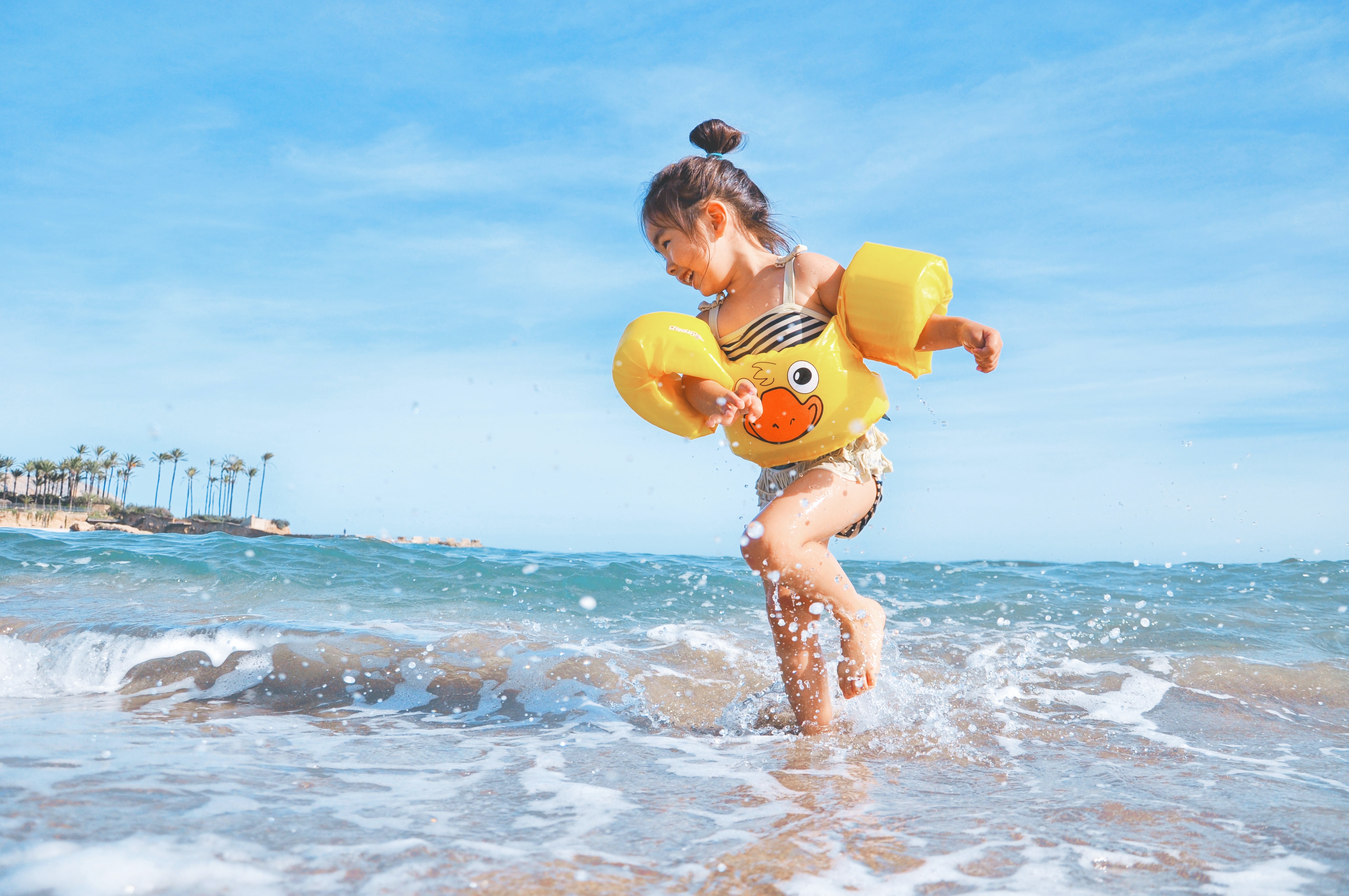 A child playing at the beach