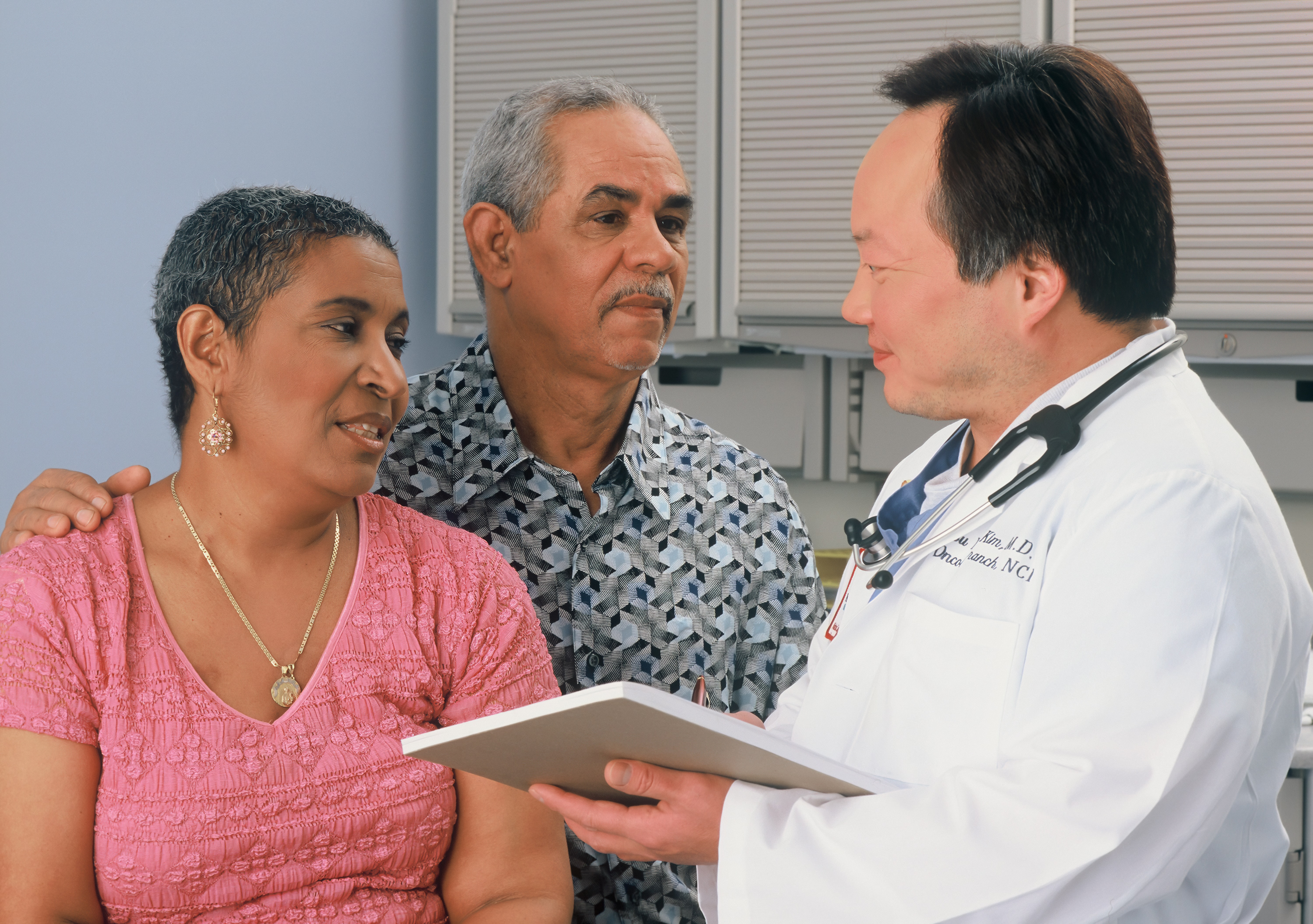 A couple speaking to a doctor